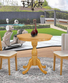El juego de cocina Eden de 3 piezas contiene una mesa redonda de comedor con