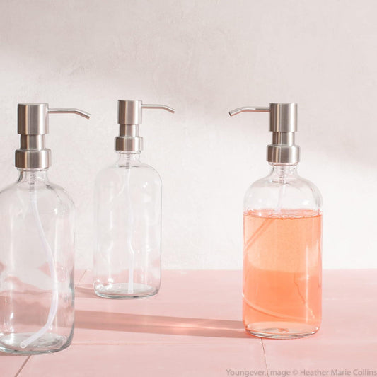 Botellas redondas Boston de vidrio transparente de 16 onzas con bombas de acero - VIRTUAL MUEBLES